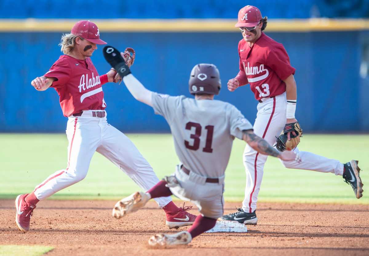 Alabama infielder Jim Jarvis (10) steps on second base to force out Texas A&M outfielder Jordan Thompson (31) as Alabama Crimson Tide takes on Texas A&M Aggies during the SEC baseball tournament at the Hoover Metropolitan Stadium in Hoover, Ala., on Friday, May 27, 2022.