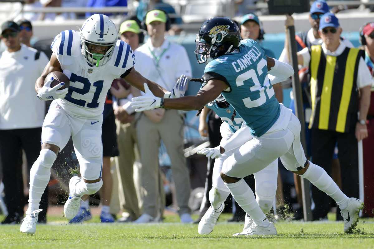 Jacksonville Jaguars cornerback Tyson Campbell (32) tries to get a hand on Indianapolis Colts running back Nyheim Hines (21) on a second quarter pass play. The Jacksonville Jaguars hosted the Indianapolis Colts at TIAA Bank Field in Jacksonville, Florida for the Jaguars final game of the season Sunday, January 9, 2022. The Jaguars finished out their season with a 26 to 11 victory over the Colts. [Bob Self/Florida Times-Union] Jki 010922 Bsjaguarsvscolt 25