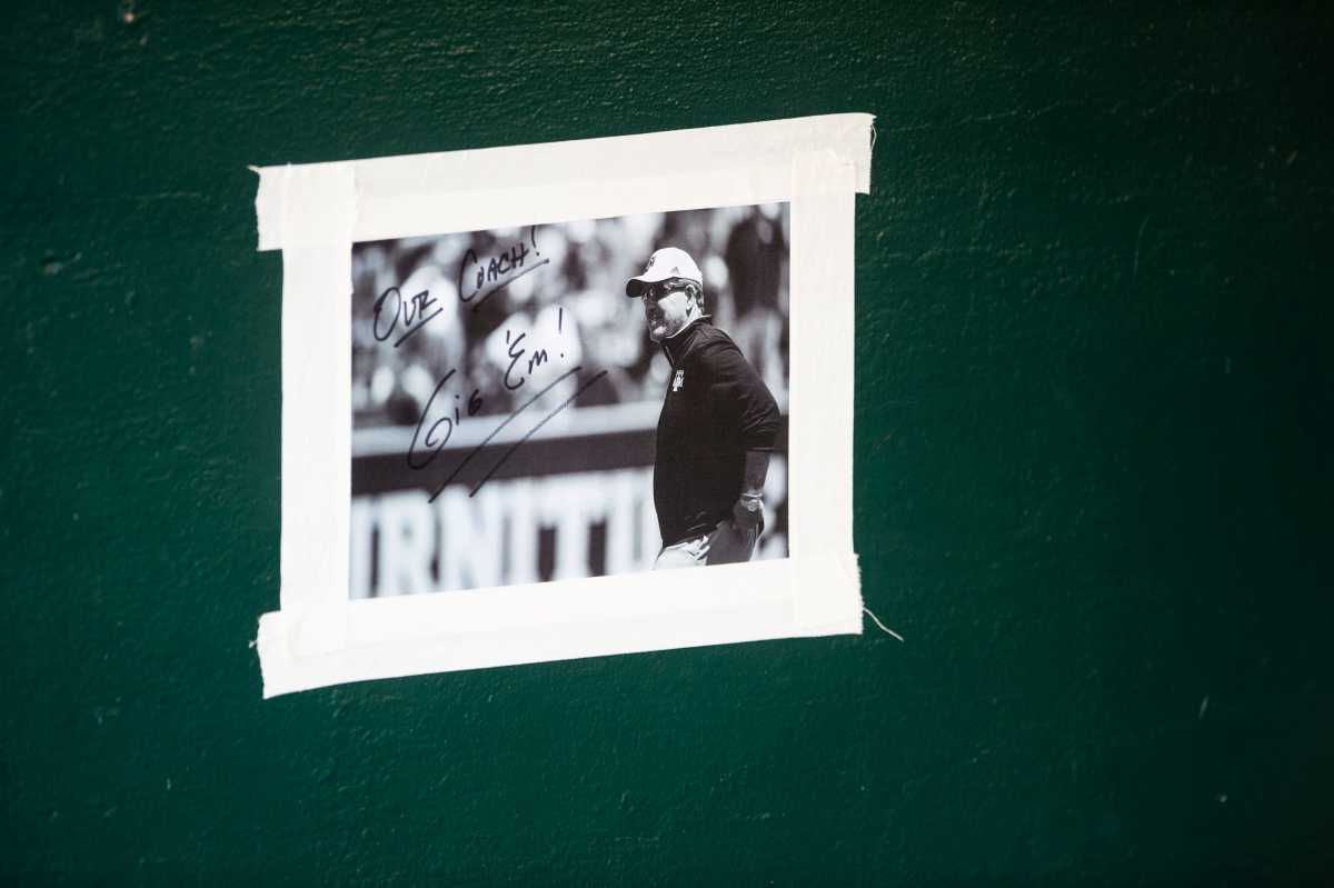 A photo of Texas A&M football coach Jimbo Fisher hangs in the Aggies dugout as they take on Alabama Crimson Tide during the SEC baseball tournament at the Hoover Metropolitan Stadium in Hoover, Ala., on Friday, May 27, 2022.