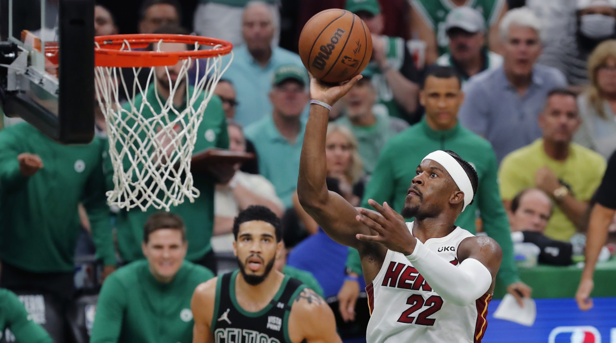 Heat’s Jimmy Butler shoots in front of Celtics’ Jayson Tatum.
