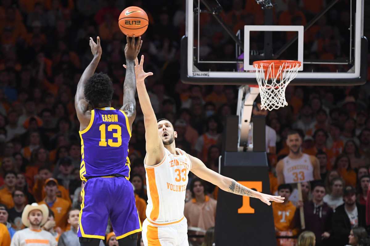 Tennessee forward Uros Plavsic (33) defends LSU forward Tari Eason s shot during a basketball game between Tennessee and LSU at Thompson-Boling Arena in Knoxville, Tenn.