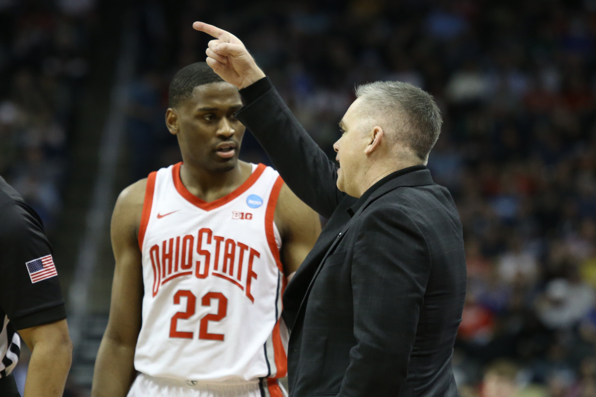 Ohio State Buckeyes head coach Chris Holtmann advises Ohio State Buckeyes guard Malaki Branham (22) in the second half against the Loyola (Il) Ramblers during the first round of the 2022 NCAA Tournament at PPG Paints Arena.