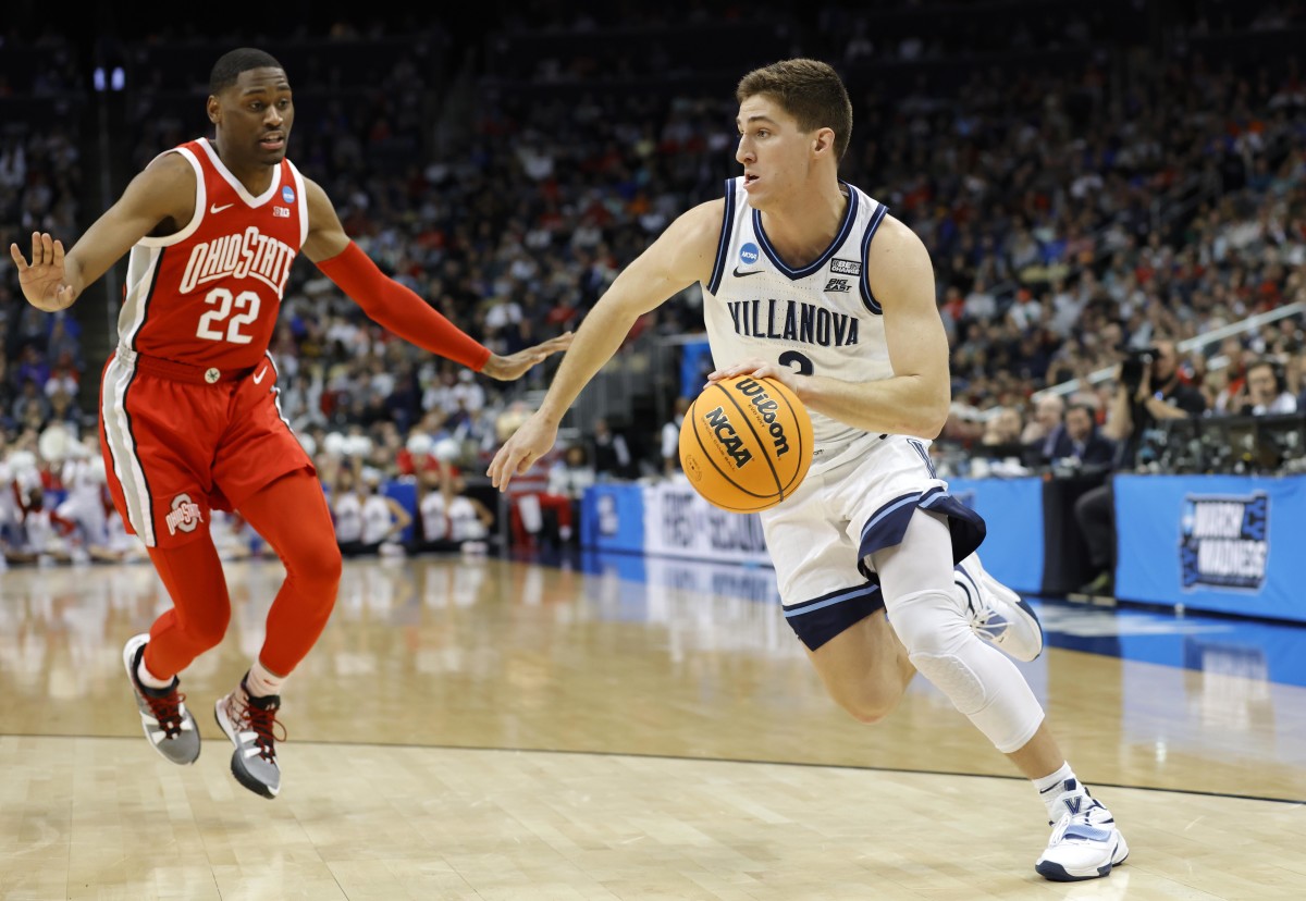 Villanova Wildcats guard Collin Gillespie (2) dribbles the ball around Ohio State Buckeyes guard Malaki Branham (22) in the second half during the second round of the 2022 NCAA Tournament at PPG Paints Arena.