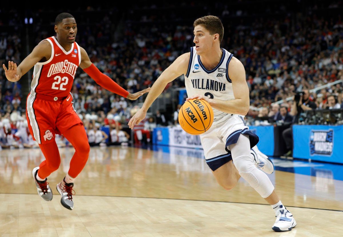 Villanova Wildcats guard Collin Gillespie (2) dribbles the ball around Ohio State Buckeyes guard Malaki Branham (22) in the second half during the second round of the 2022 NCAA Tournament at PPG Paints Arena.