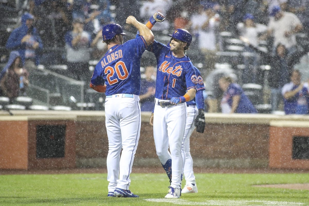 May 28, 2022; New York City, New York, USA; New York Mets second baseman Jeff McNeil (1) is greeted by first baseman Pete Alonso (20) after hitting a three run home run against the Philadelphia Phillies in the fourth inning at Citi Field. Mandatory Credit: Wendell Cruz-USA TODAY Sports