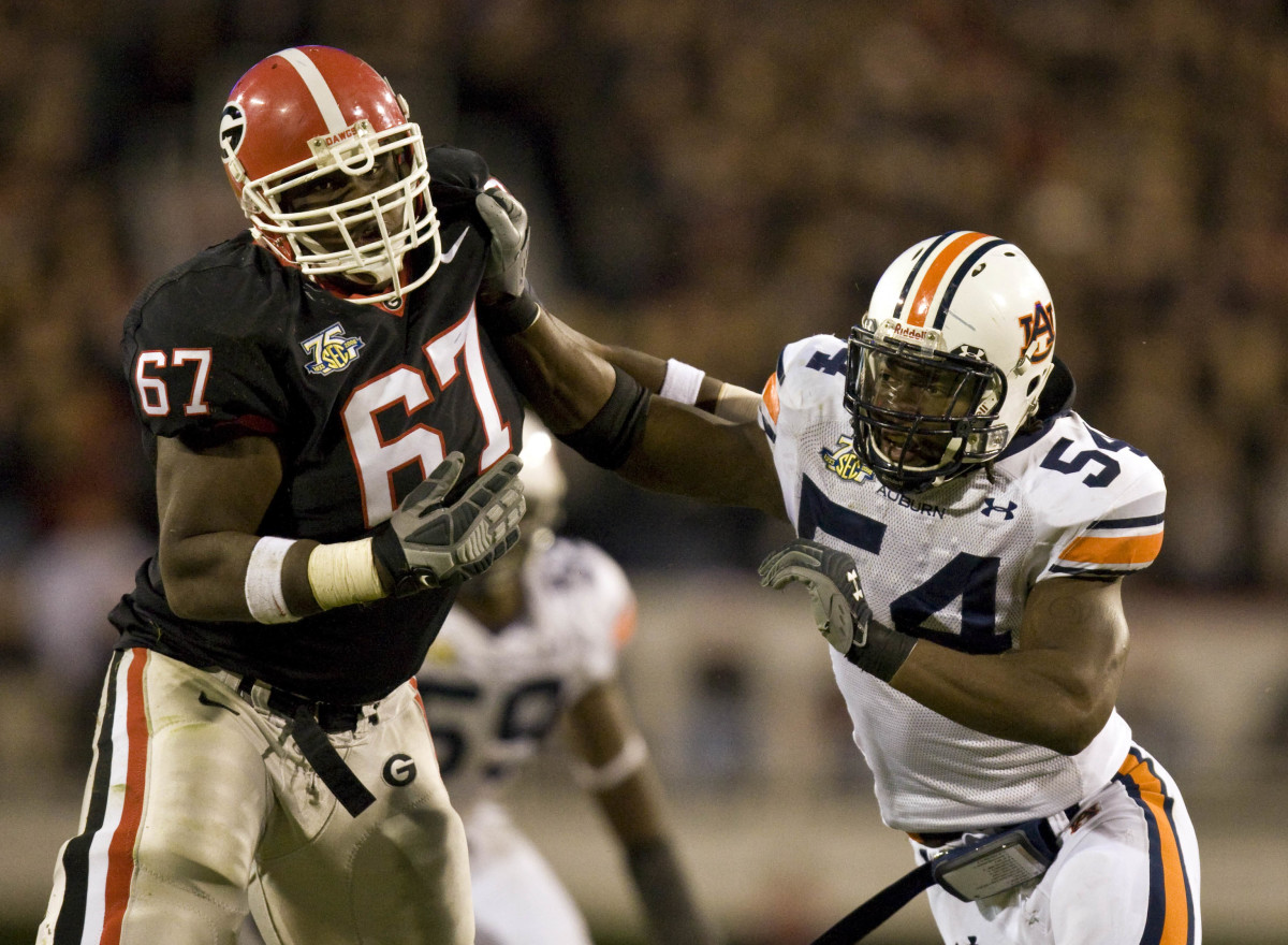 Nov 10, 2007; Athens, GA, USA; Auburn Tigers defensive end Quentin Groves (54) works against Georgia Bulldogs tackle Chester Adams (67) during the second half at Sanford Stadium in Athens, Georgia. Georgia defeated Auburn 45-20. Mandatory Credit: Paul Abell-USA TODAY Sports Copyright © 2007 Paul Abell
