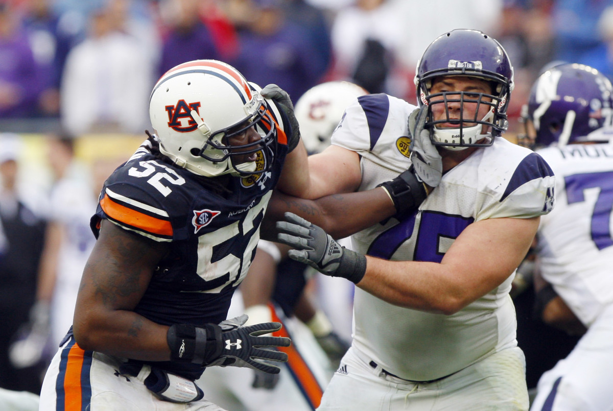 January 1,2010; Tampa, FL, USA; Auburn Tigers defensive end Antonio Coleman (52) rushes past Northwestern Wildcats offensive lineman Al Netter (75) during the second half of the 2010 Outback Bowl at Raymond James Stadium. Auburn won 38-35.