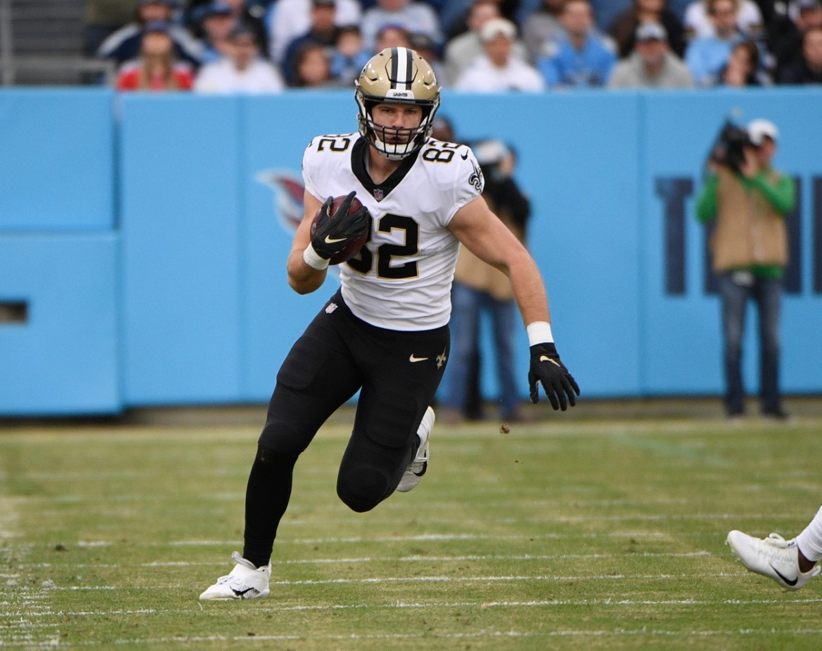 Saints tight end Adam Trautman (82) runs after a catch against Tennessee. Mandatory Credit: Steve Roberts-USA TODAY Sports
