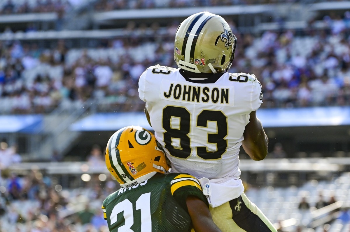 New Orleans tight end Juwan Johnson (83) catches a touchdown against Packers safety Adrian Amos (31). Mandatory Credit: Tommy Gilligan-USA TODAY