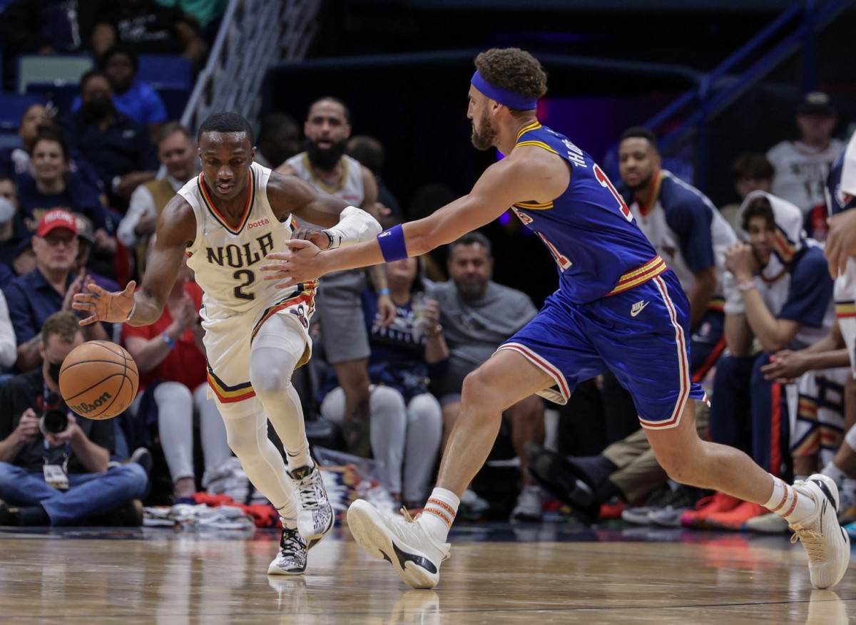 Apr 10, 2022; New Orleans, Louisiana, USA; New Orleans Pelicans guard Jared Harper (2) dribbles against \Golden State Warriors guard Klay Thompson (11) during the second half at the Smoothie King Center. Mandatory Credit: Stephen Lew-USA TODAY Sports