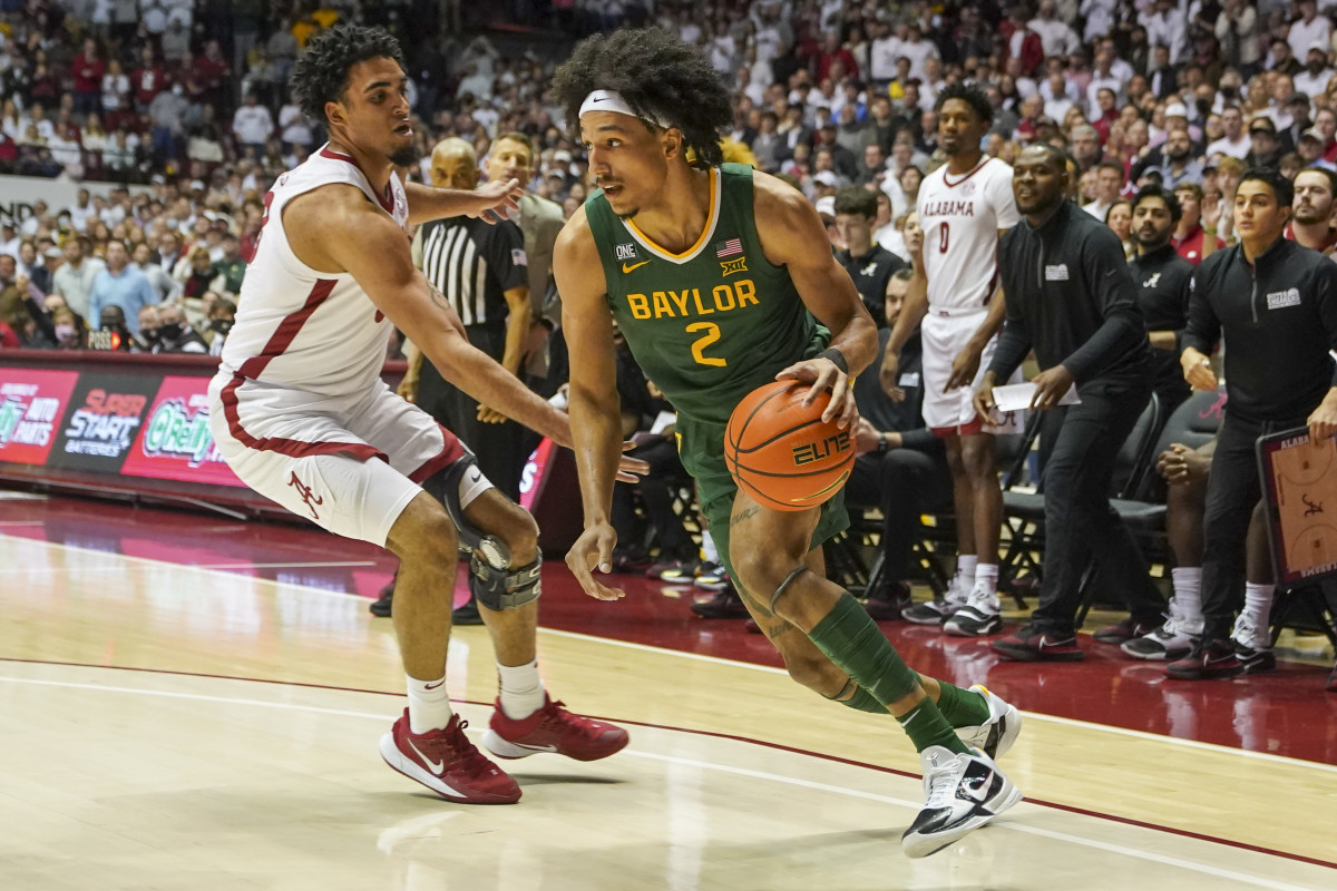 Baylor Bears guard Kendall Brown (2) drives to the basket against Alabama Crimson Tide forward James Rojas (33) during the first half at Coleman Coliseum.