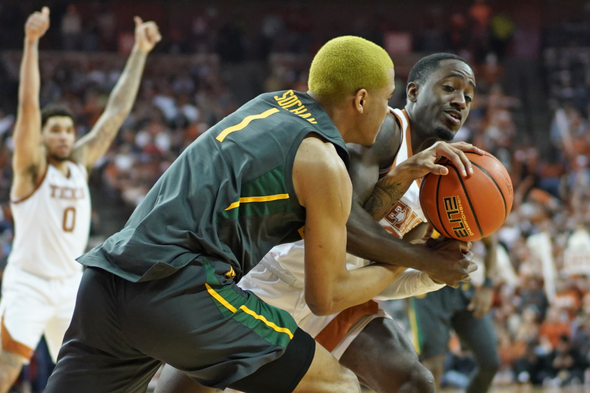 Texas Longhorns guard Courtney Ramey (3) battles for the loose ball with Baylor Bears forward Jeremy Sochan (1) during the second half at Frank C. Erwin Jr. Center.