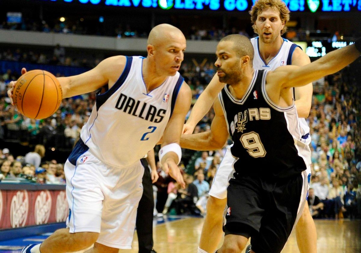 Jason Kidd drives on Tony Parker