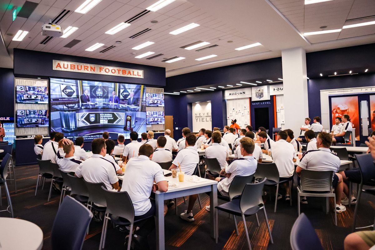 The Auburn baseball team watching the NCAA selection show.