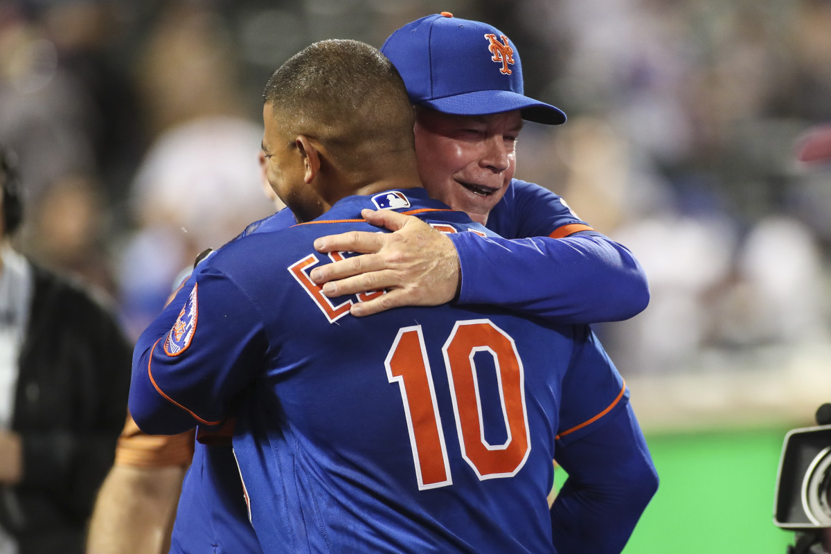 May 29, 2022; New York City, New York, USA; New York Mets third baseman Eduardo Escobar (10) is congratulated by manager Buck Showalter (11) after hitting a game winning RBI double to beat the Philadelphia Phillies 5-4 in ten innings at Citi Field.