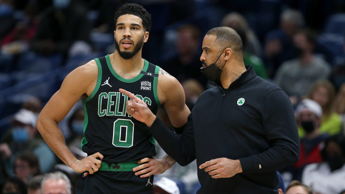 Boston Celtics head coach Ime Udoka (right) talks to forward Jayson Tatum.