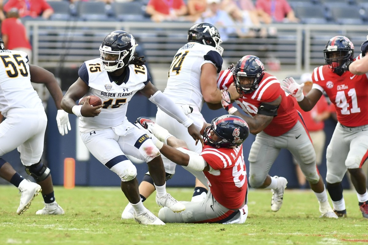 Sep 22, 2018; Oxford, MS, USA; Kent State Golden Flashes quarterback Woody Barrett (15) scrambles as he is defended by Mississippi Rebels defensive end Ryder Anderson (89) during the second quarter at Vaught-Hemingway Stadium.