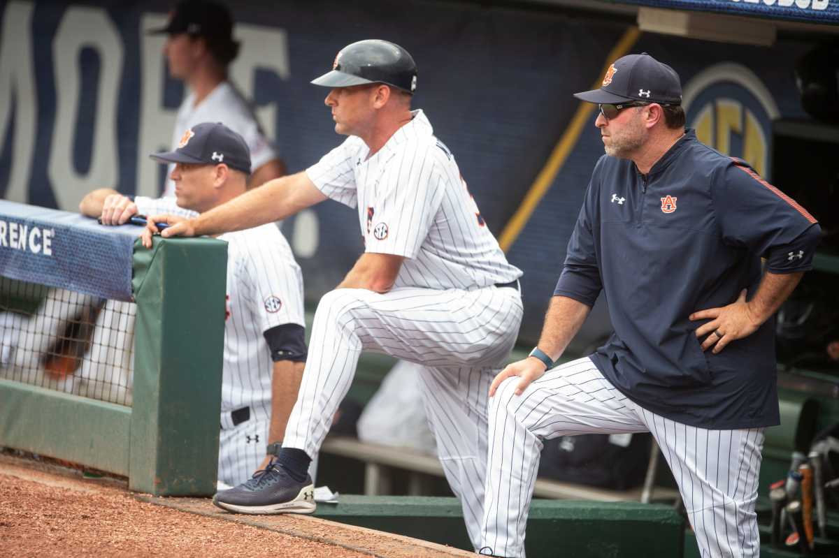 Auburn coach Butch Thompson, right, watches on from the dugout during the SEC baseball tournament at Hoover Metropolitan Stadium in Hoover, Ala., on Wednesday, May 25, 2022.