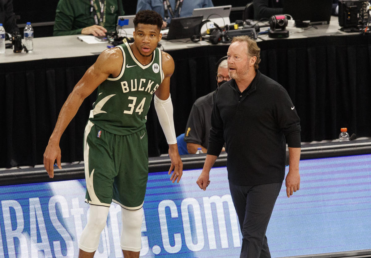Milwaukee Bucks head coach Mike Budenholzer talks with forward Giannis Antetokounmpo (34) during the third quarter against the Phoenix Suns during game three of the 2021 NBA Finals at Fiserv Forum.