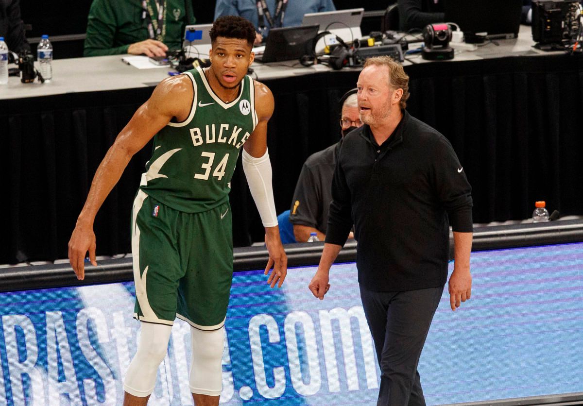 Milwaukee Bucks head coach Mike Budenholzer talks with forward Giannis Antetokounmpo (34) during the third quarter against the Phoenix Suns during game three of the 2021 NBA Finals at Fiserv Forum.
