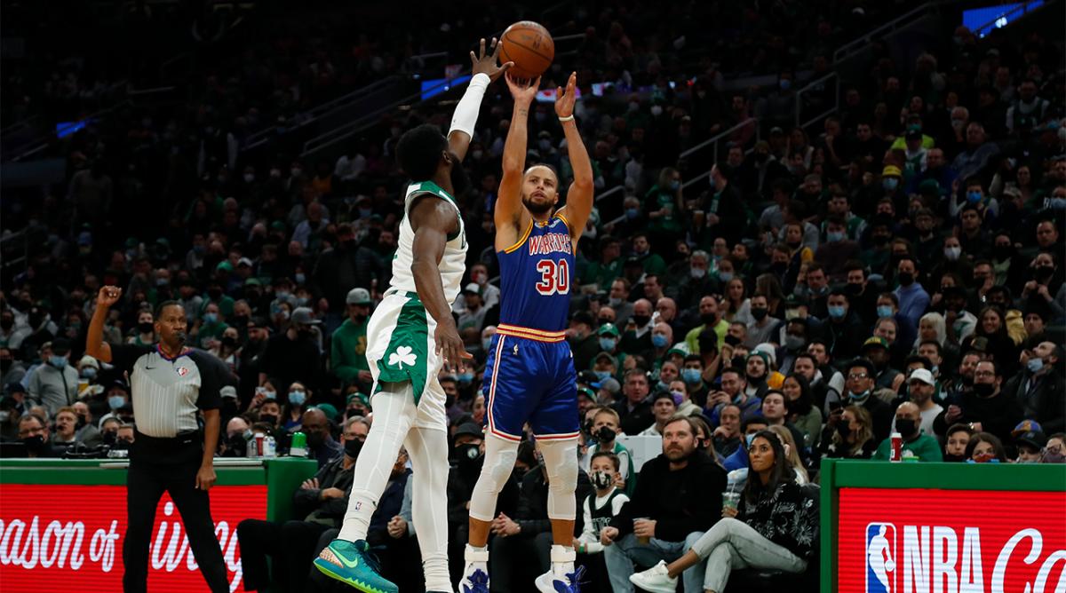 Dec 17, 2021; Boston, Massachusetts, USA; Golden State Warriors guard Stephen Curry (30) shots over Boston Celtics guard Jaylen Brown (7) during the first quarter at TD Garden.