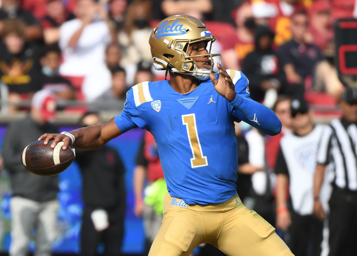 UCLA Bruins quarterback Dorian Thompson-Robinson (1) throws a pass against the Southern California Trojans in the first half at the Los Angeles Memorial Coliseum.
