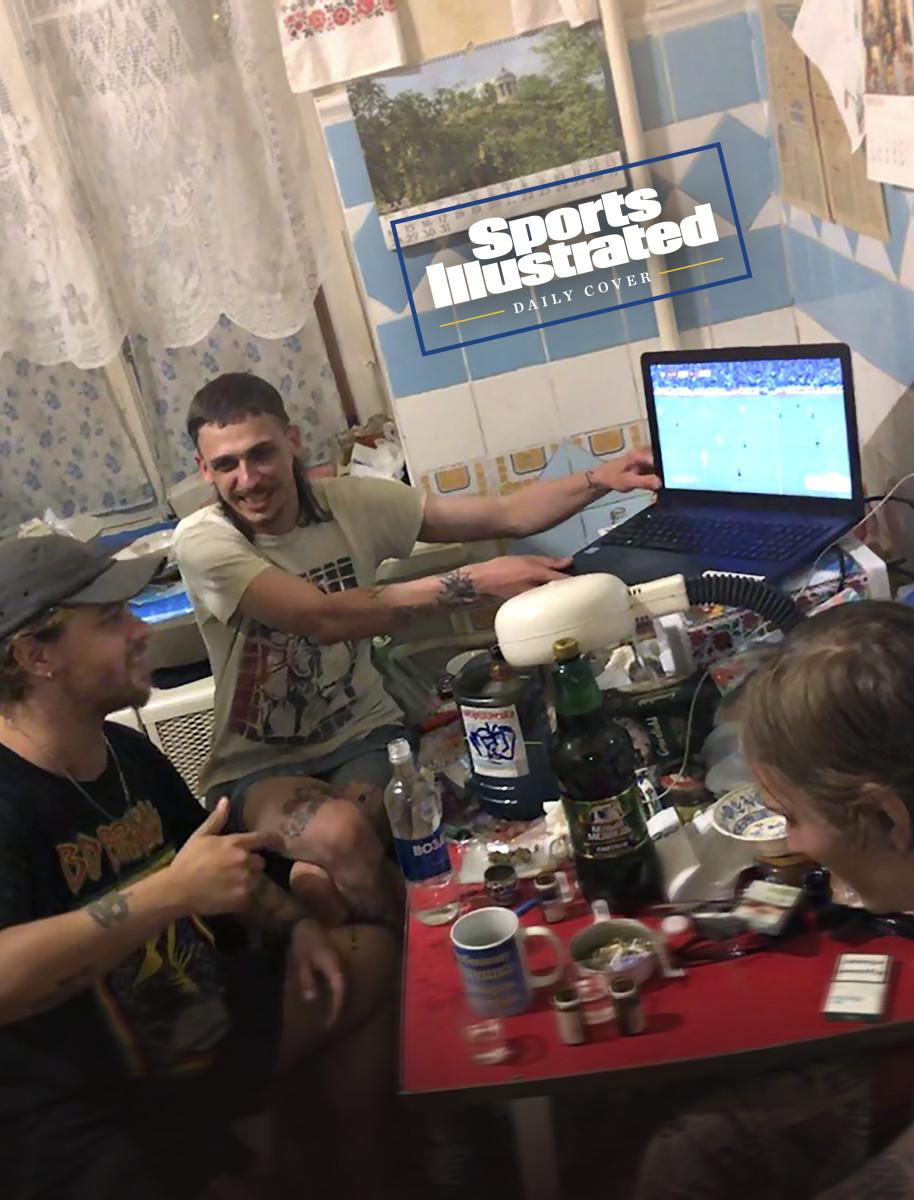 Sports Illustrated asked Ukraine fans to send in pictures of themselves watching Wednesday's game. Mytsuk (seated, in black shirt) gathered at home with friends.