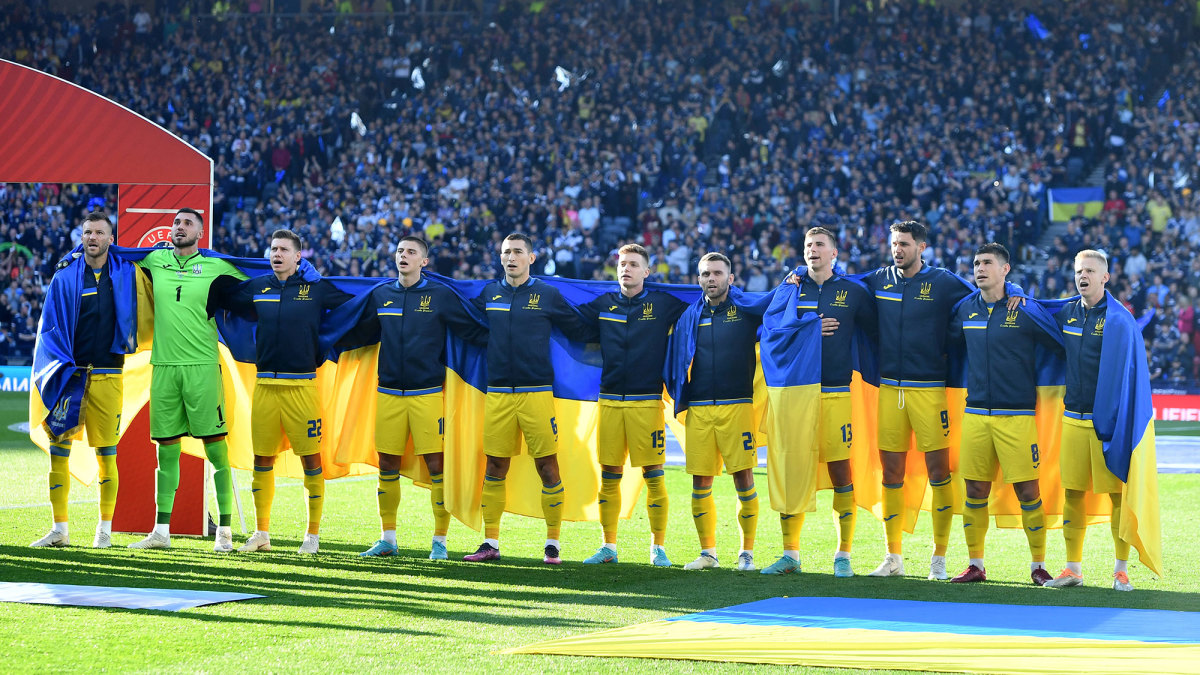 Ukraine players sing the national anthem before a World Cup qualifying playoff vs. Scotland