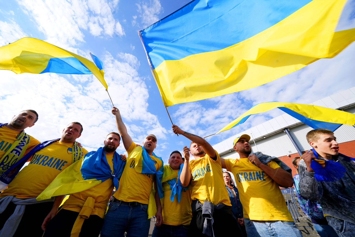 Ukraine fans wave their flag outside Hampden Park in Scotland
