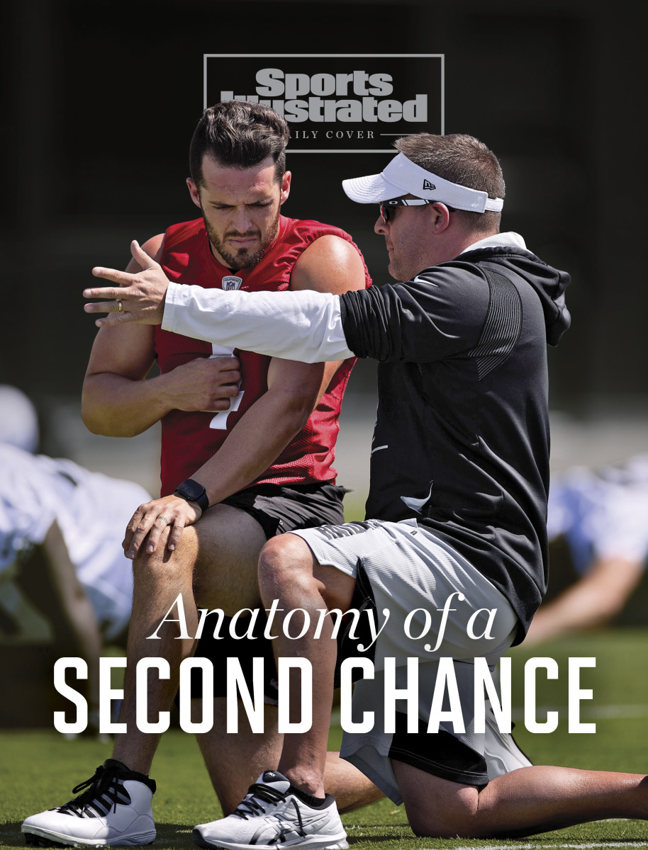 New Raiders coach Josh McDaniels talks to Derek Carr during team OTAs.