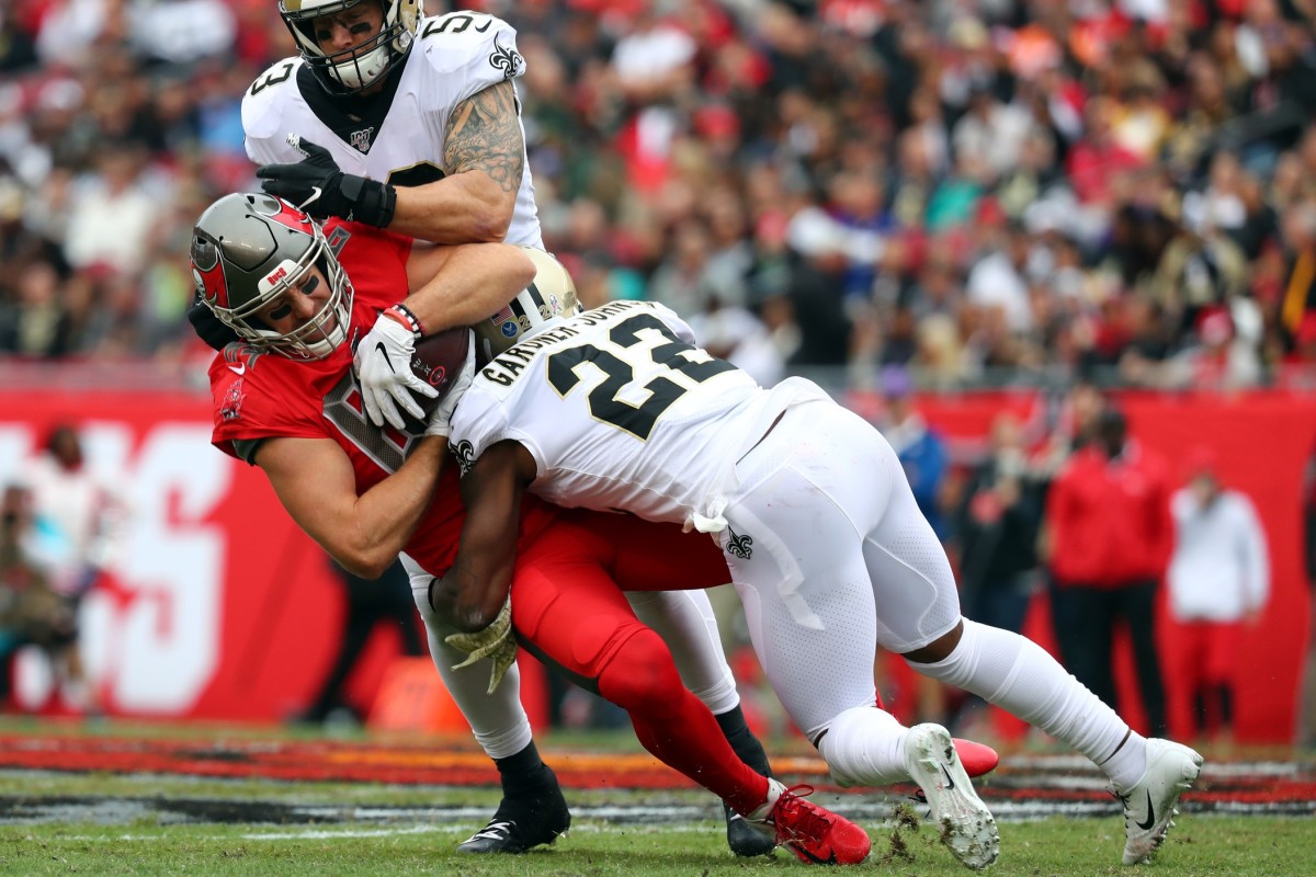Tampa Bay tight end Cameron Brate (84) tackled by New Orleans Saints defensive back Chauncey Gardner-Johnson (22). Mandatory Credit: Kim Klement-USA TODAY 