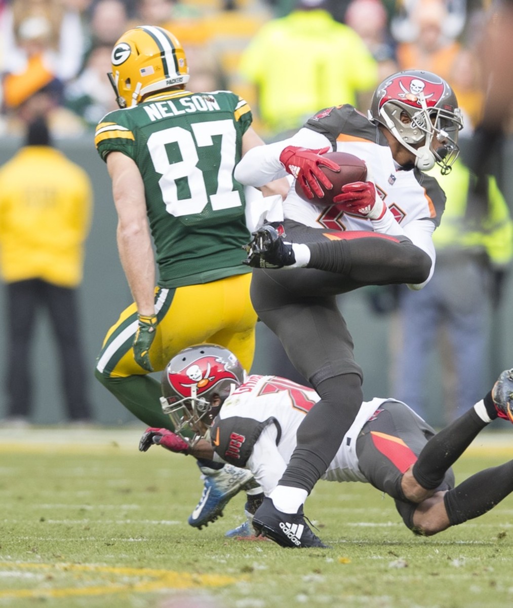 Former Tampa Bay Buccaneers safety Justin Evans (21) intercepts a pass against the Green Bay Packers. Mandatory Credit: Jeff Hanisch-USA TODAY Sports