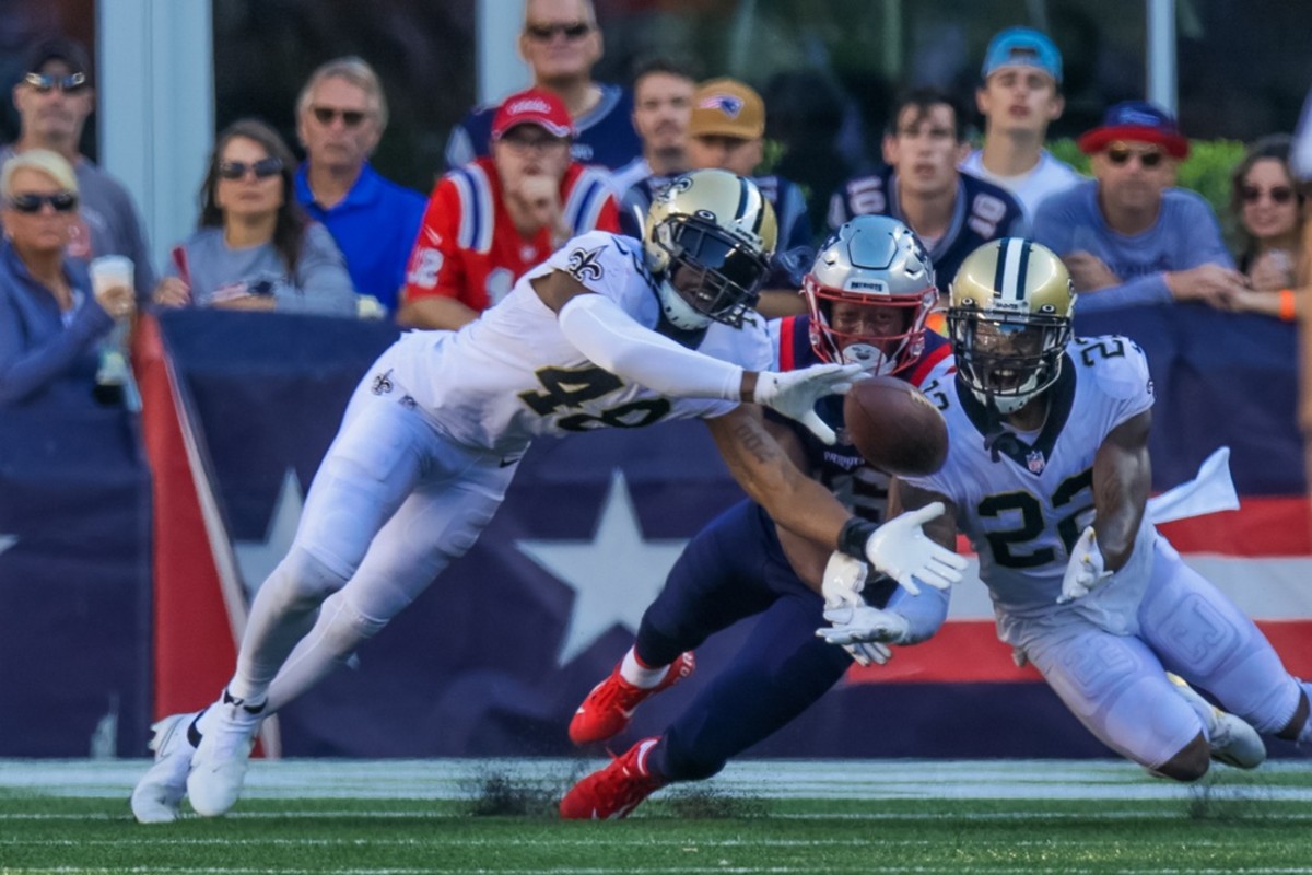 New Orleans Saints defensive back J.T. Gray (48) breaks up a pass from New England Patriots quarterback Mac Jones. Mandatory Credit: Stephen Lew-USA TODAY Sports