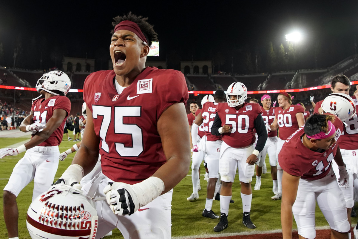 Stanford Cardinal offensive tackle Walter Rouse (75) celebrates after the game against the Washington Huskies at Stanford Stadium.