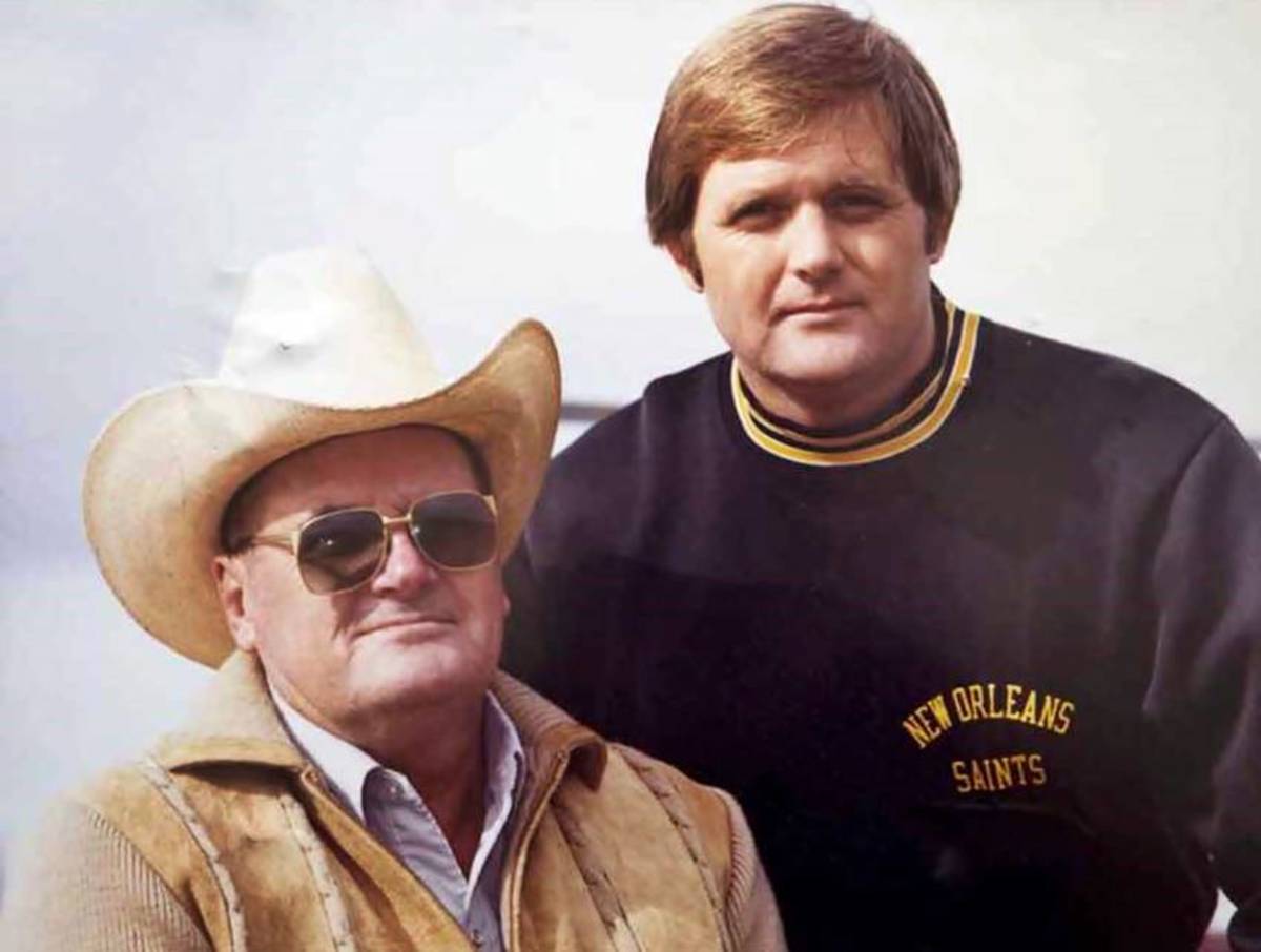 Head Coach "Bum" Phillips (in hat) and son, defensive coordinator Wade Phillips (top) were with the Saints from 1981 to 1985. Credit: crescentcitysports.com