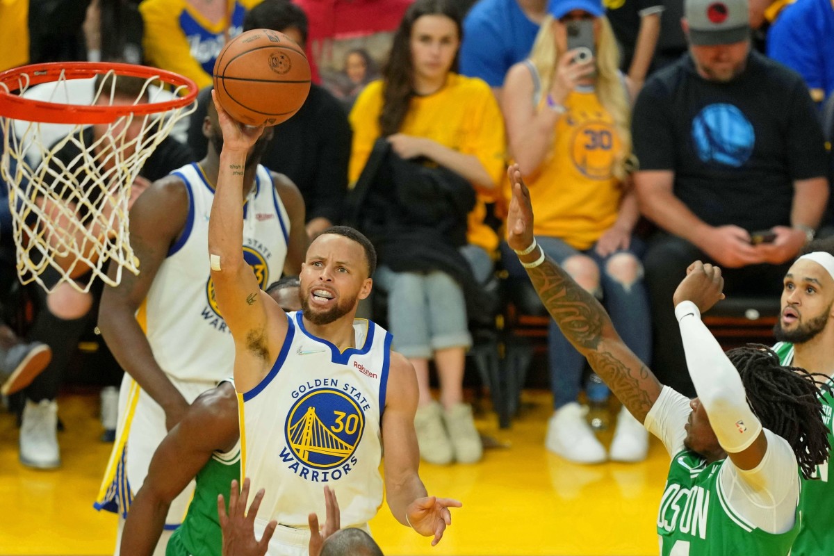 Jun 2, 2022; San Francisco, California, USA; Golden State Warriors guard Stephen Curry (30) shoots the ball against the Boston Celtics during the first half of game one of the 2022 NBA Finals at Chase Center. Mandatory Credit: Darren Yamashita-USA TODAY Sports