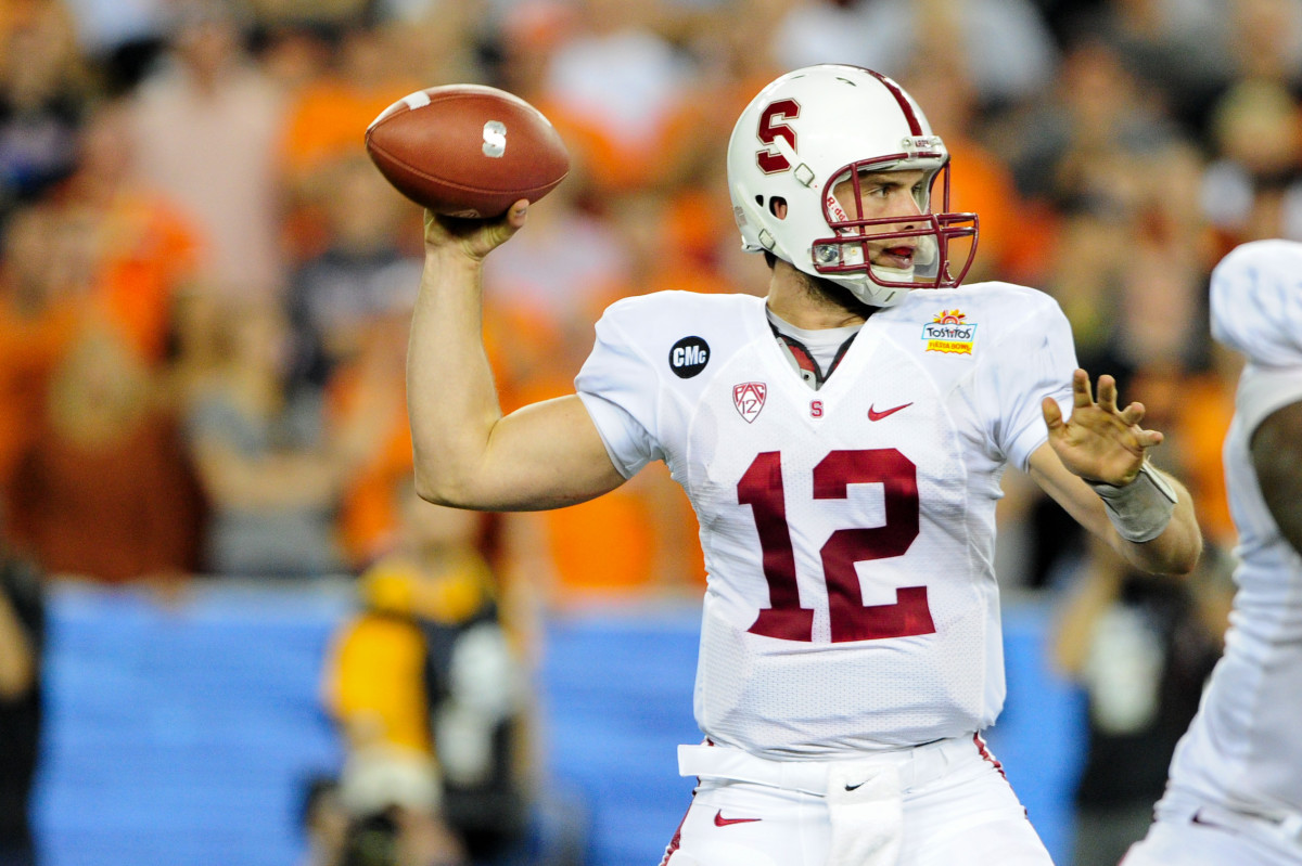 Stanford Cardinal quarterback Andrew Luck (12) throws during the first half against the Oklahoma State Cowboys in the 2012 Fiesta Bowl at University of Phoenix Stadium