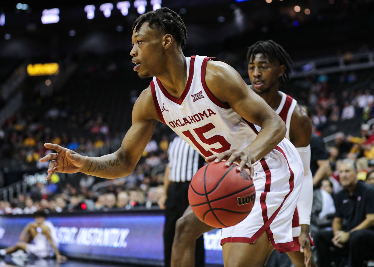 Oklahoma Sooners guard Alondes Williams (15) dribbles the ball as Stanford Cardinal guard Daejon Davis (1) defends during the first half at Sprint Center.