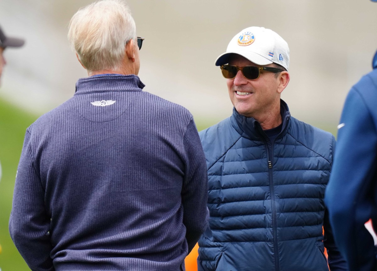 Denver Broncos general manager George Paton and president of football operations John Elway during OTA workouts at the UC Health Training Center.