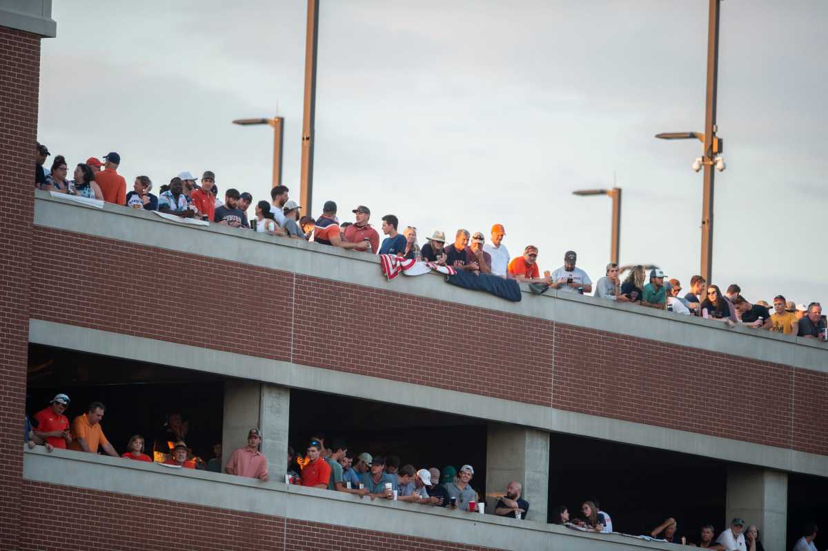 Fans watch from a near by parking deck as Auburn Tigers take on Florida State Seminoles during the NCAA regional baseball tournament at Plainsman Park in Auburn, Ala., on Saturday, June 4, 2022.