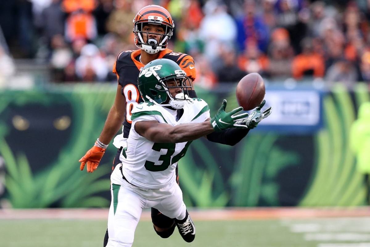 New York Jets cornerback Maurice Canady (37) nearly intercepts a deep pass intended for Cincinnati Bengals wide receiver Tyler Boyd (83) during the second quarter of a Week 13 NFL game, Sunday, Dec. 1, 2019, at Paul Brown Stadium in Cincinnati.
