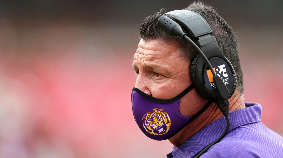 Nov 21, 2020; Fayetteville, Arkansas, USA; LSU Tigers head coach Ed Orgeron looks on during the game against the Arkansas Razorbacks at Donald W. Reynolds Razorback Stadium.