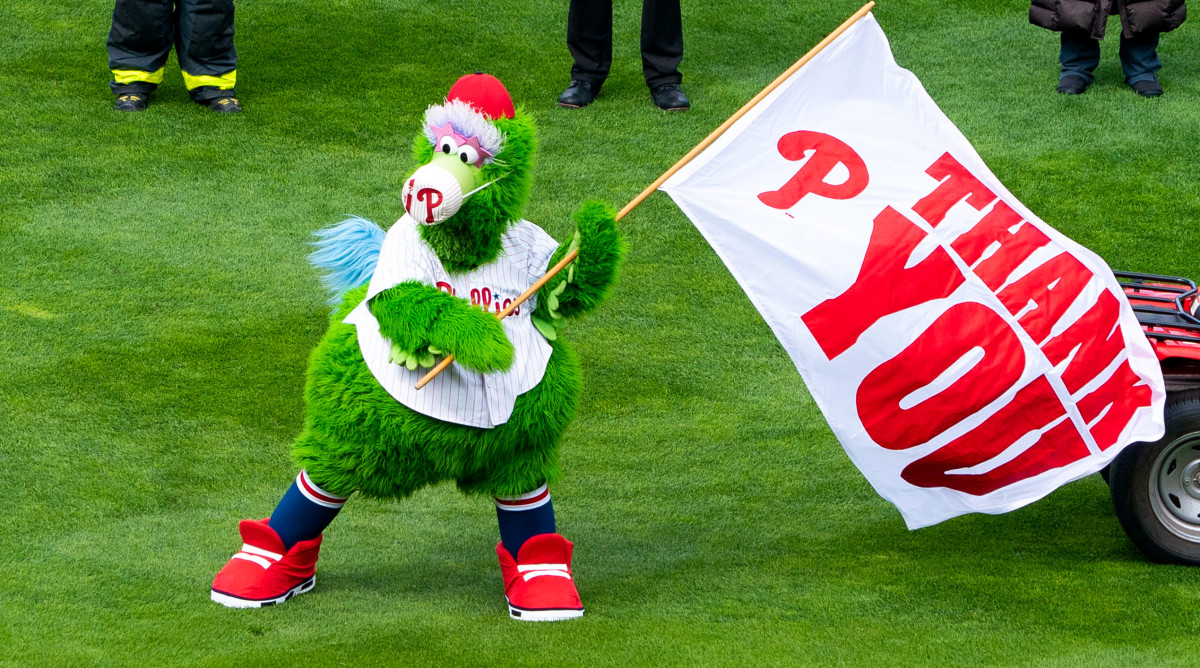 Apr 1, 2021; Philadelphia, Pennsylvania, USA; The Phillie Phanatic waves a flag thanking first responders before a game between the Philadelphia Phillies and the Atlanta Braves at Citizens Bank Park.