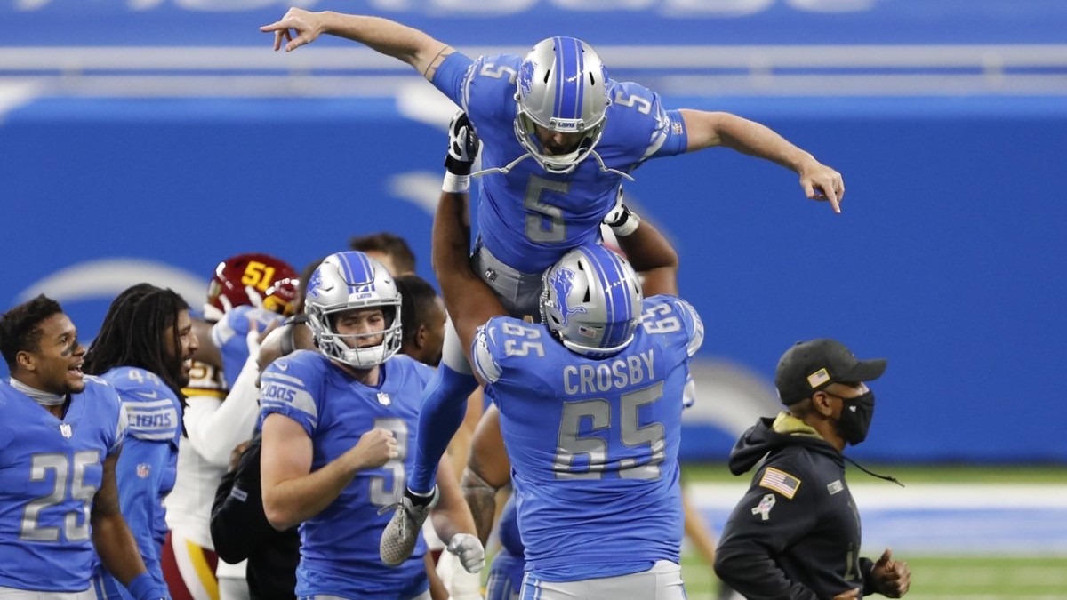 Ex-Lions kicker Matt Prater is lifted up in the air by Crosby, after making the game-winning field goal against the Washington Football Team. 