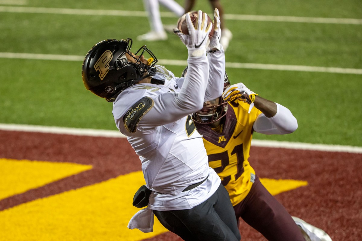 Purdue Boilermakers wide receiver Rondale Moore (4) attempts to catch a pass as Minnesota Golden Gophers defensive back Justus Harris (21) plays defense in the first half at TCF Bank Stadium.