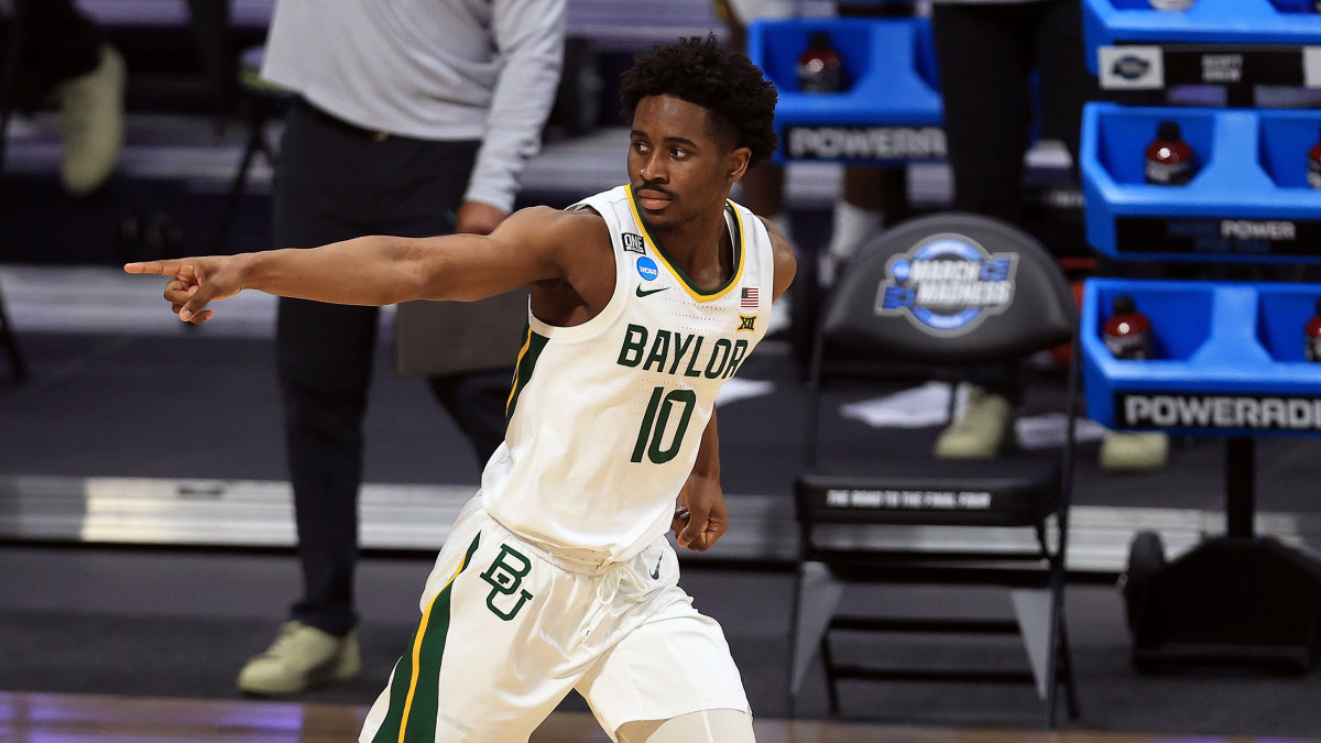 Baylor's Adam Flagler reacts after hitting a three