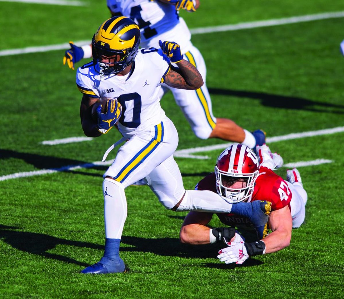 AP photo Indiana linebacker Micah McFadden (47) is kicked in the face while trying to stop Michigan wide receiver Giles Jackson (0) as he runs the ball up field Saturday in Bloomington, Ind.