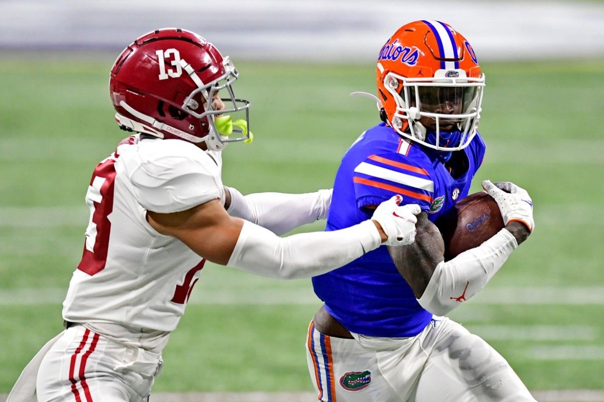 Florida Gators wide receiver Kadarius Toney (1) makes a catch against Alabama Crimson Tide defensive back Malachi Moore (13) in the SEC Championship at Mercedes-Benz Stadium.