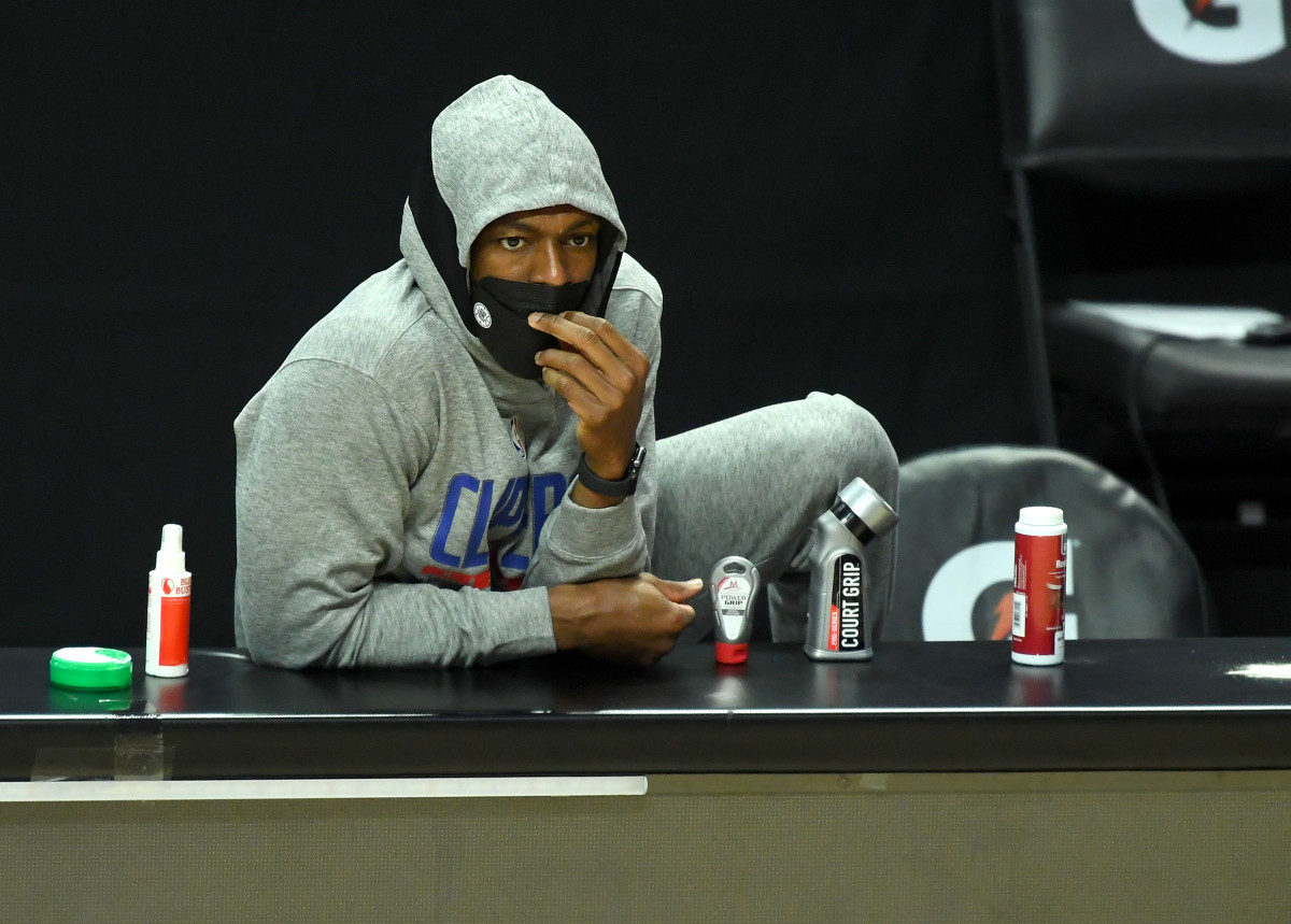 Mar 30, 2021; Los Angeles, California, USA; Los Angeles Clippers guard Rajon Rondo (7) looks on from the bench during the first quarter against the Orlando Magic at Staples Center. Mandatory Credit: Jayne Kamin-Oncea-USA TODAY Sports