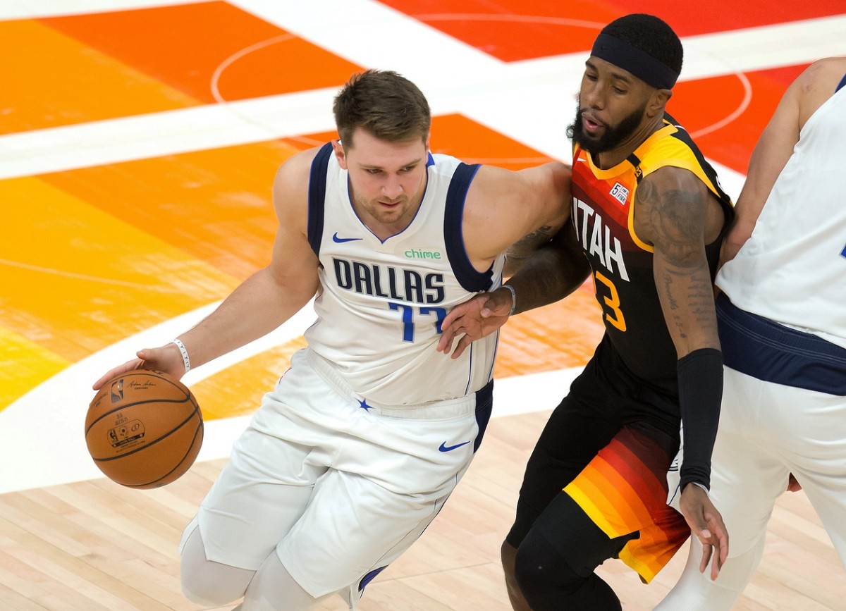 Royce O'Neale (23) guards Luka Doncic (77)